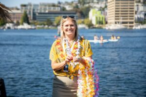 Woman Handing Out Leis